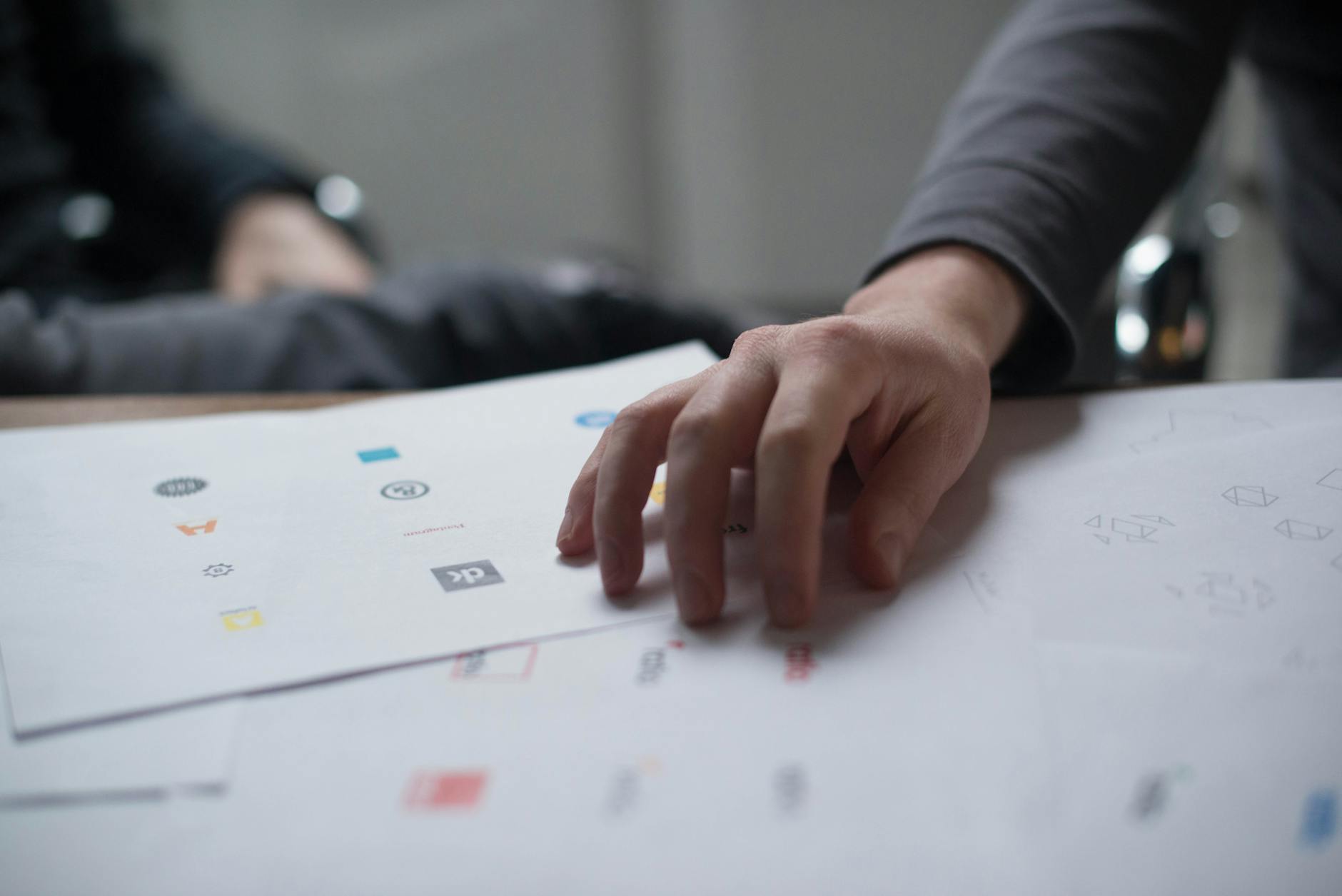 hand on top of paper