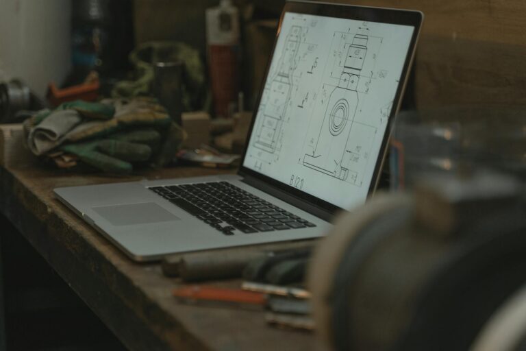 macbook pro on brown wooden table