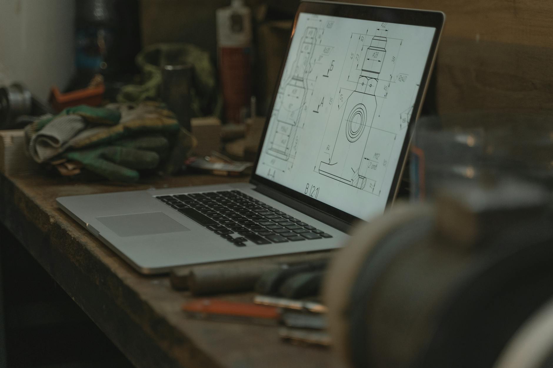 macbook pro on brown wooden table